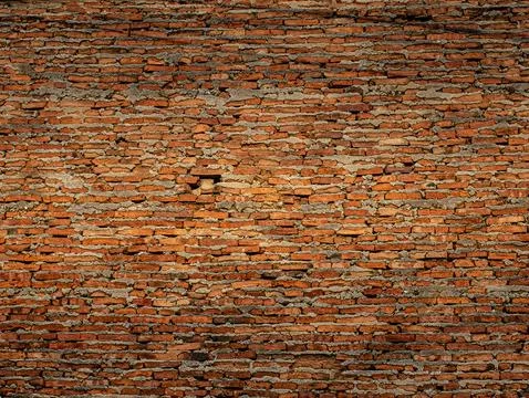 Weathered Red Brick Wall with Uneven Mortar Texture, Rustic Old Masonry Bac.. Stockfoto's