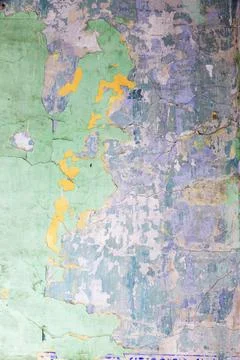 Weathered rough painted surface with patterns of cracks and peeling Foto stock