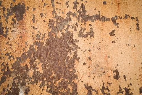 Weathered rough yellow  painted surface with patterns of cracks and peeling. Stock Photos