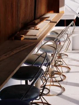Weathered round bar stools with backrest and wooden table being demolished. Foto stock