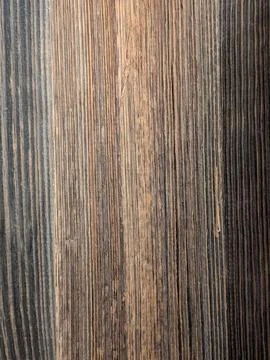 Weathered rustic wood plank surface with vertical grain, dark tones, worn d.. Stock Photos