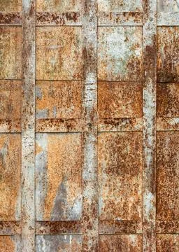 Weathered rusty metal surface with grid pattern creates an expressive indus.. Stock Photos