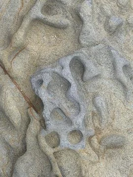 Weathered Sandstone Rock with Natural Honeycomb Weathering and Swirl Patterns Stock Photos