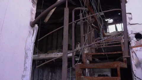 A weathered spiral staircase in a neglected structure Stock Footage 264302225