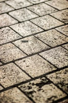 Weathered square stone pavement texture Фото
