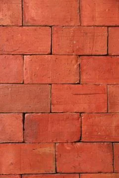 Weathered stained old brick wall background. Stock Photos