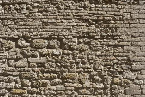 Weathered stained old brick wall background Stock Photos