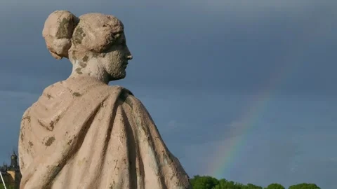 Weathered statue and rainbow over Djurgården after rain Stock Footage 320744394