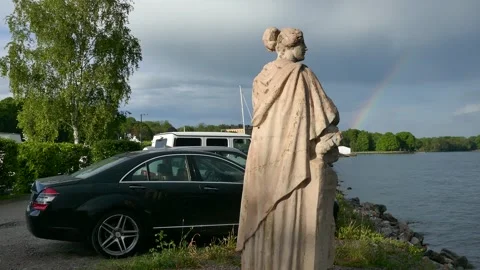 Weathered statue and rainbow over Djurgården after rain Stock Footage 320744397