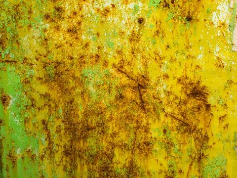 Weathered steel surface with rust and peeling paint outdoors Photos