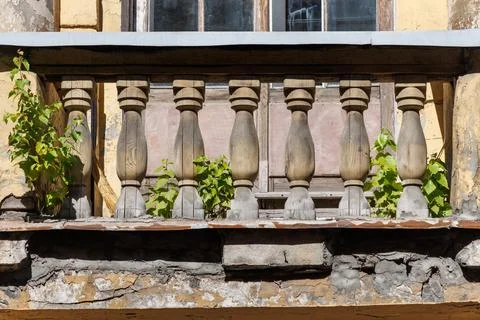 Weathered stone balusters line a balcony ledge Stock Photos