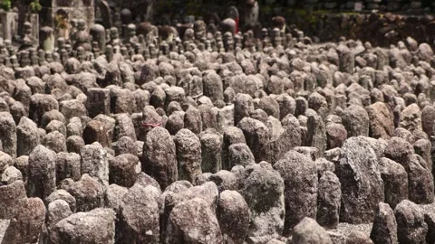 Weathered stone Buddhist memorial figures at Adashino Nenbutsu-ji Temple Stock Footage 345227405