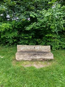 Weathered stone garden bench Фото