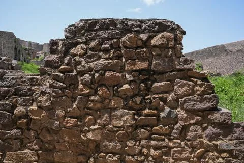 Weathered stone masonry wall texture from an ancient fortress ruin Stock Photos