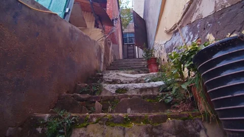 Weathered Stone Steps Leading Up Between Old Urban Buildings with Moss Video stock 336522964