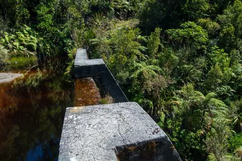 Weathered Stone Structure Over Tranquil Water Stock Photos