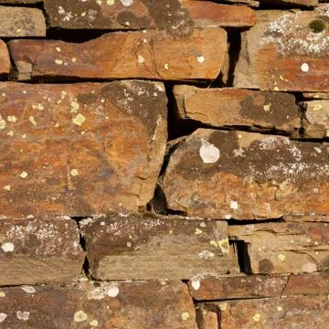 Weathered stone wall background Stock Photos