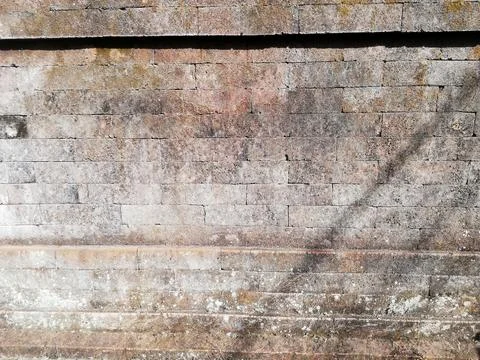 Weathered stone wall in close up Stock Photos
