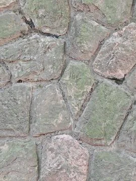 Weathered stone wall with moss, rough masonry texture background 写真素材