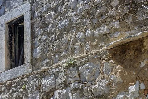 Weathered Stone Wall With Old Window Frame and Rustic Texture on Abandoned .. Stock Photos