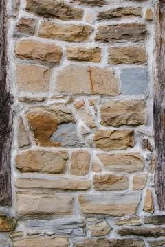 Weathered stone wall showcasing rustic textures and colors Stock Photos