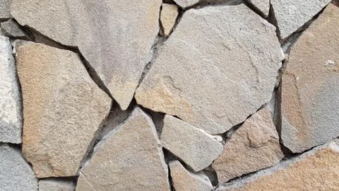 Weathered stone wall texture. Architecture details Stock Photos