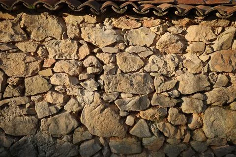 Weathered stone wall texture. Texture of natural stone wall Stock Photos