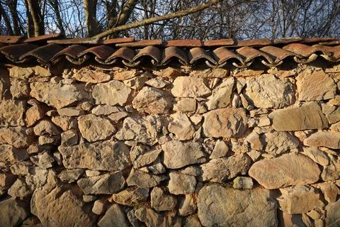 Weathered stone wall texture. Texture of natural stone wall Stock Photos