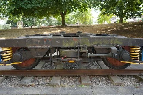 Weathered Train Bogie And Railway Tracks In A Park, Derby, England. Stock Photos
