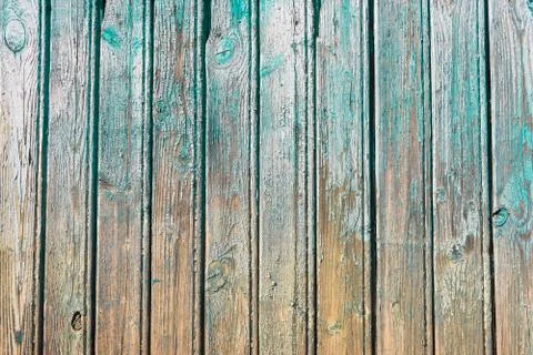 Weathered turquoise colored paint on rustic wooden panel Stock Photos