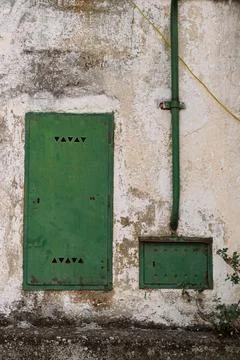 Weathered Wall With Green Doors Stock Photos