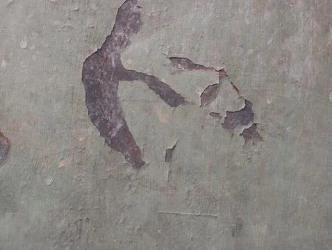 Weathered wall texture with peeling pale green paint Foto stock
