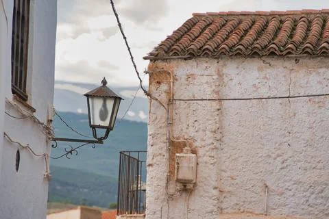Weathered walls frame a rustic lamp 库存照片