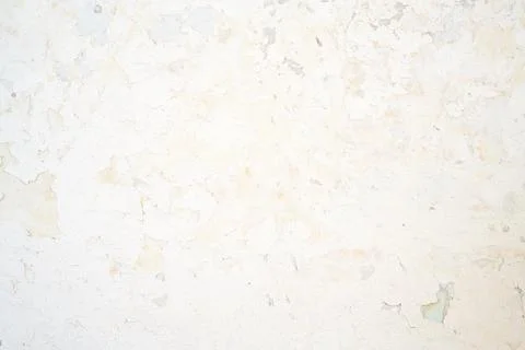 Weathered Whitewashed Clay Wall with Yellowed Patches and Cracks Stock Photos