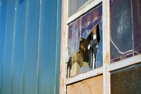 Weathered Window with Broken Plastic and Rusty Frame Detail Stock Photos