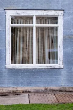 Weathered window with sidewalk Stock Photos