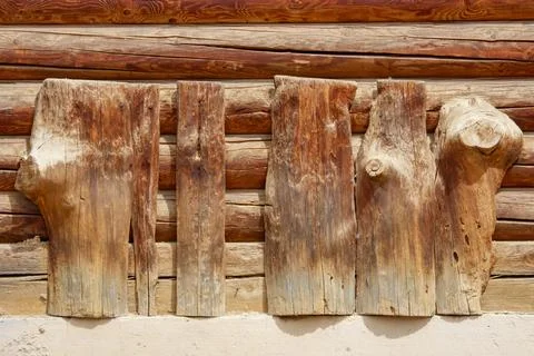 Weathered wood logs form rustic wall paneling 写真素材