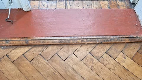 Weathered Wooden Door Threshold with Herringbone Parquet Floor Stock Footage 339758783