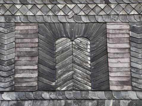 Weathered wooden shingle pattern with chevron panels Stock Photos