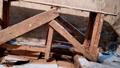 Weathered Wooden Support Beam in Rustic Interior with Dusty Debris Below Stock Footage 332322774