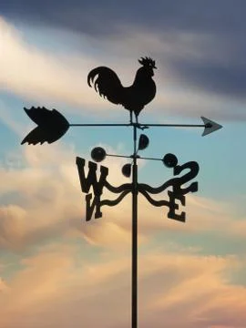 Weathervane against cloudscape Stock-Fotos