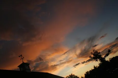 Weathervane at sunset Photos