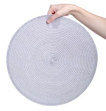 Weave placemat in hand isolated Stock Photos