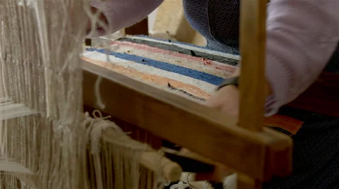 Weaver working on a traditional loom. Stock-Footage 63166900