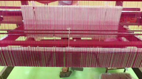 Weaving brocade using a traditional loom machine with yarn Stock Footage 59902682