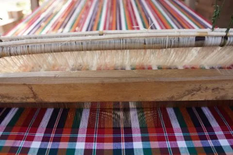Weaving Fabric on a Loom Foto stock