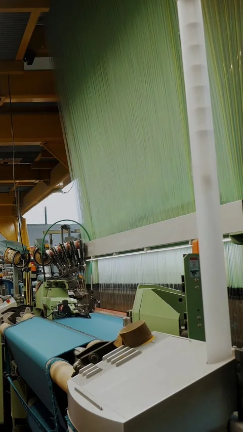 Weaving factory workshop. Textile factory equipment. automated weaving looms Stock Footage 319390280