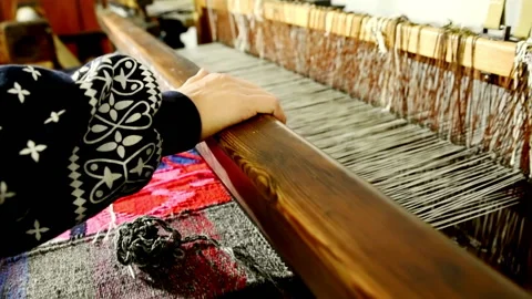 Weaving. Lines of yarn threads on a loom for clothes at a textile factory Stock Footage 196828107