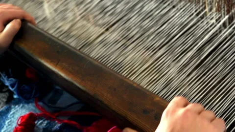 Weaving. Lines of yarn threads on a loom for clothes at a textile factory Stock Footage 196828127