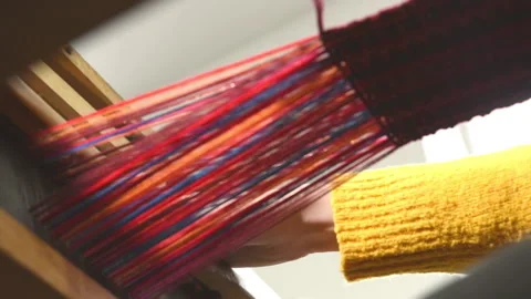 Weaving. Lines of yarn threads on a loom for clothes at a textile factory Stock Footage 196828210